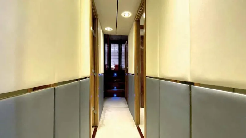 Vedo Yacht Photos Pics Luxurious hallway inside a 2004 Bilgin 30-meter yacht, featuring elegant lighting and modern design.