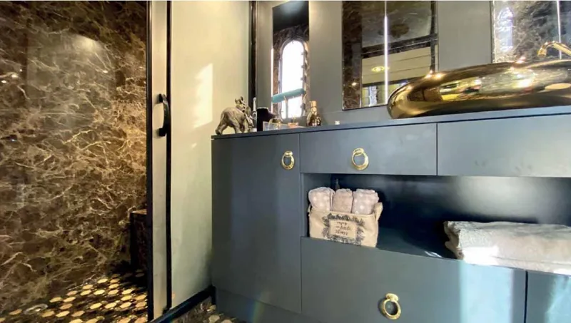 Vedo Yacht Photos Pics Luxurious bathroom with marble walls, modern vanity, and elegant fixtures in a 2004 Bilgin 30-meter yacht.