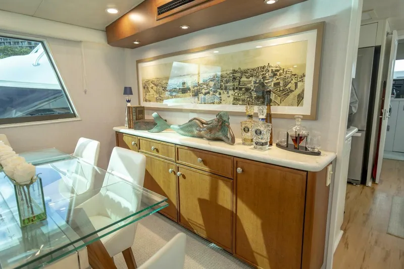  Yacht Photos Pics Luxurious 1989 Hatteras Custom Cockpit yacht interior with elegant dining area and decorative accents.