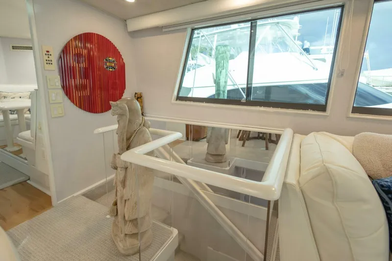  Yacht Photos Pics Interior of 1989 Hatteras Custom Cockpit yacht with sculpture and window view.