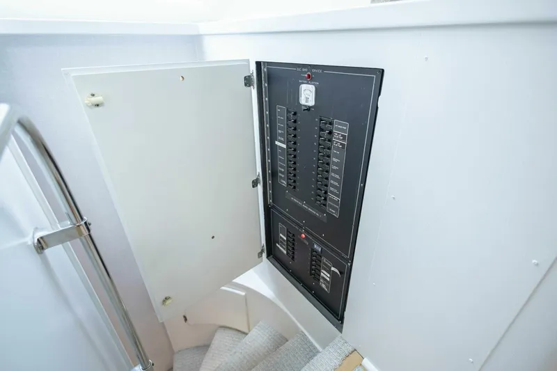  Yacht Photos Pics Electrical panel on 1989 Hatteras Custom Cockpit yacht, open door, stairway view.