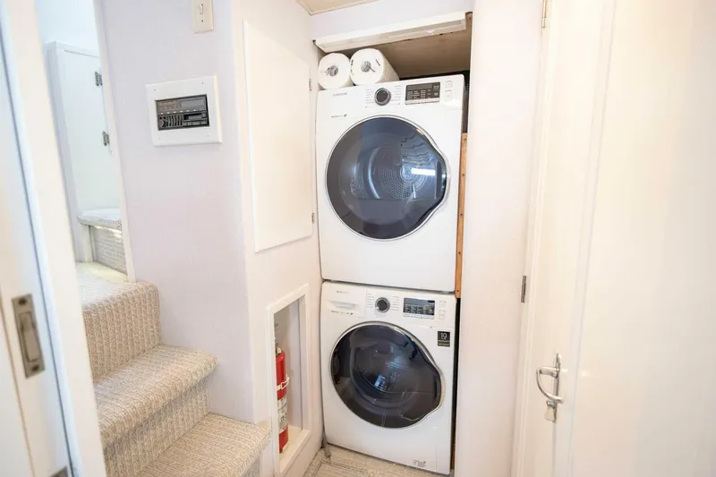  Yacht Photos Pics Stacked washer and dryer in 1989 Hatteras Custom Cockpit yacht interior.