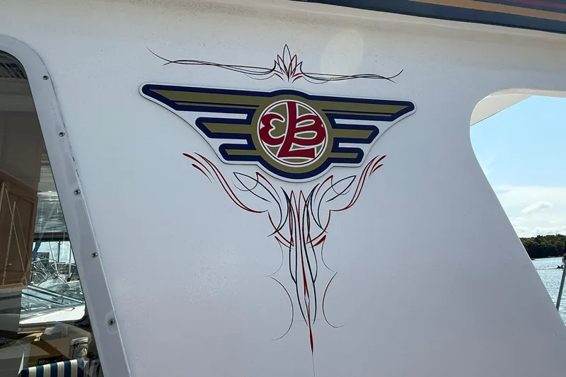  Yacht Photos Pics Decorative emblem on 2000 LEBLANC Leo 38 boat with intricate pinstriping design.