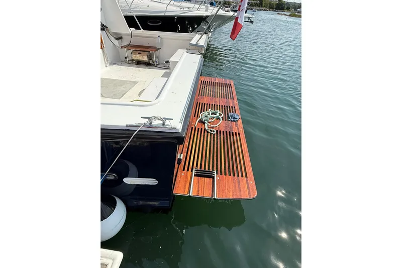  Yacht Photos Pics LEBLANC Leo 38 yacht, 2000 model, with wooden swim platform and mooring ropes.