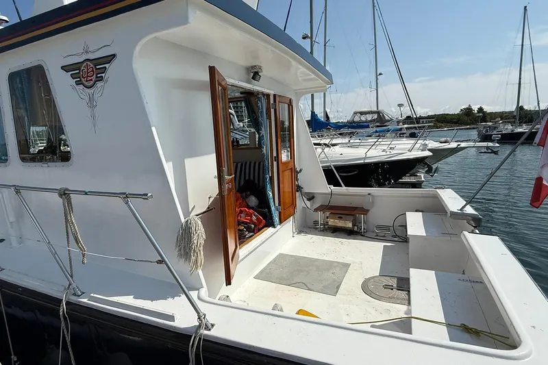  Yacht Photos Pics LEBLANC Leo 38 boat, 2000 model, docked at marina with open cabin doors.
