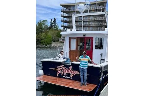  Yacht Photos Pics Two people on the deck of a 2000 LEBLANC Leo 38 boat named Zephyr.