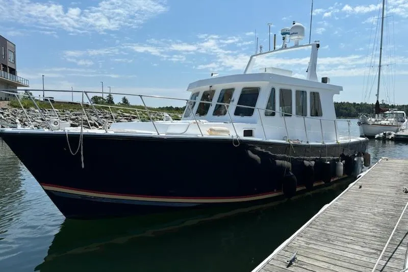  Yacht Photos Pics 2000 LEBLANC Leo 38 boat docked at marina under clear sky.