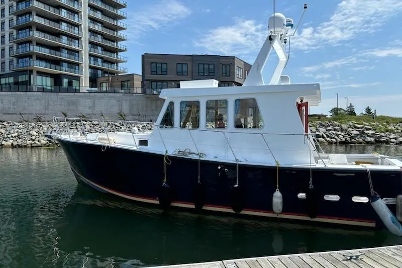  Yacht Photos Pics LEBLANC Leo 38 boat docked near modern buildings, 2000 model.