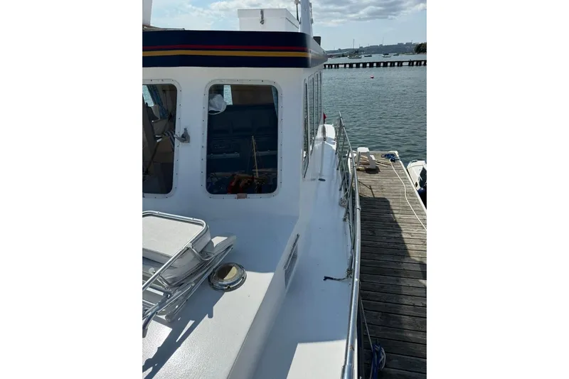  Yacht Photos Pics LEBLANC Leo 38 boat docked, showcasing deck and cabin, year 2000 model.