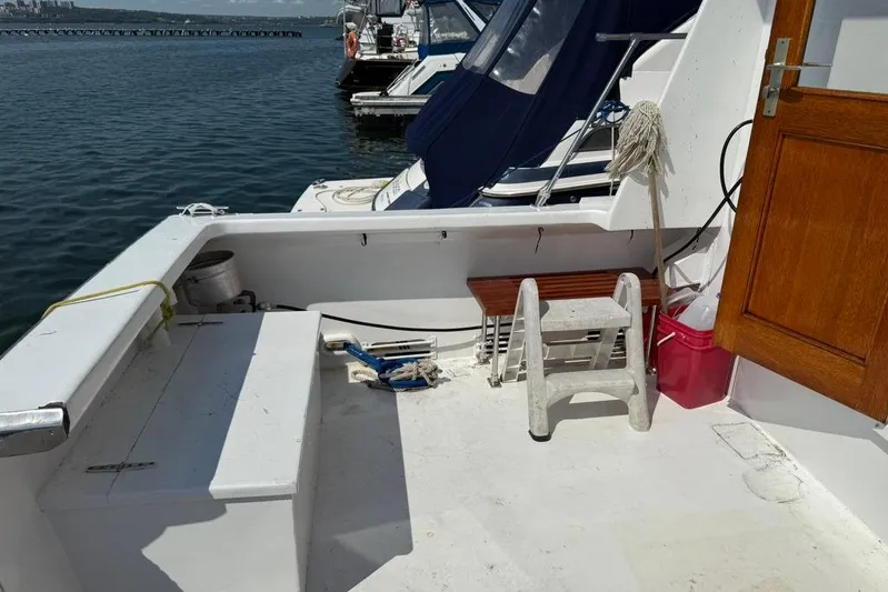  Yacht Photos Pics Deck of 2000 LEBLANC Leo 38 boat with ladder and cleaning supplies.