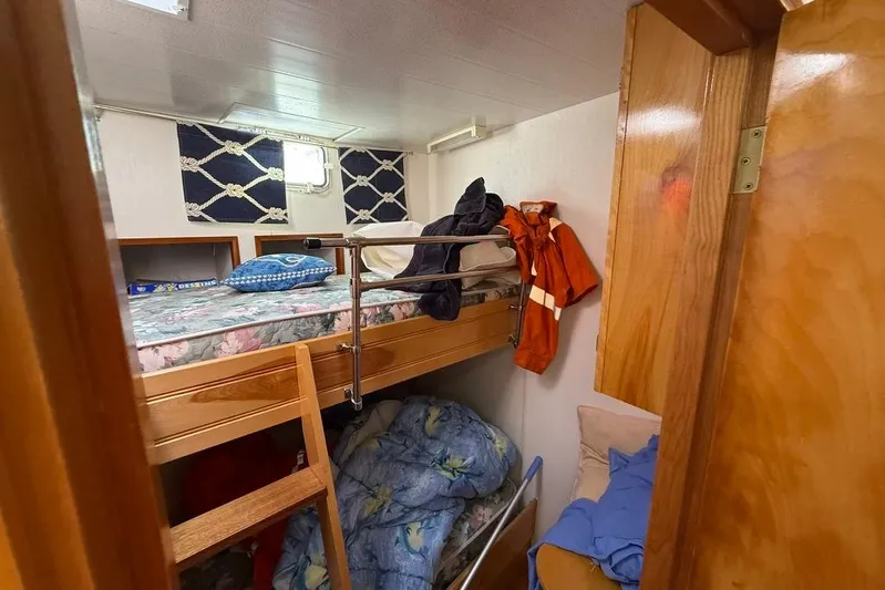  Yacht Photos Pics Cozy cabin interior of 2000 LEBLANC Leo 38 with bunk beds and nautical decor.