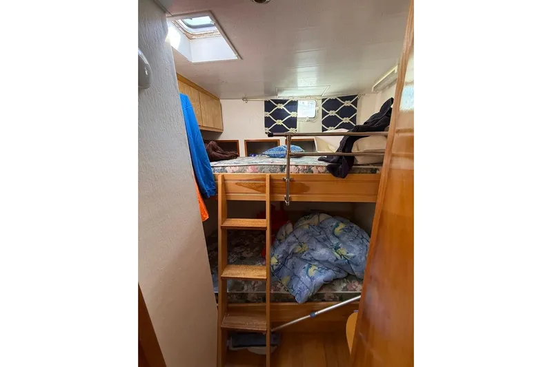  Yacht Photos Pics Interior of 2000 LEBLANC Leo 38 boat with bunk beds and wooden ladder.