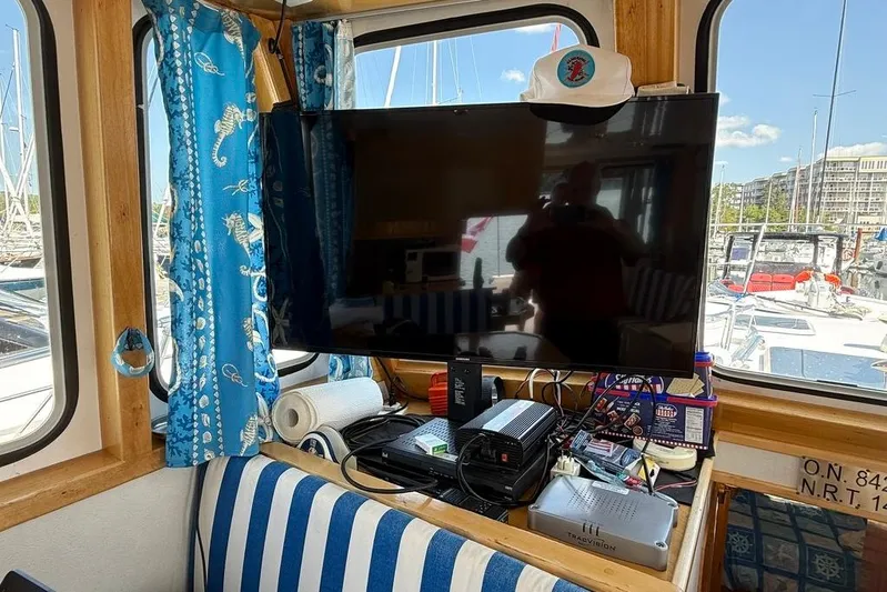  Yacht Photos Pics Interior of a 2000 LEBLANC Leo 38 boat with electronics and nautical decor.