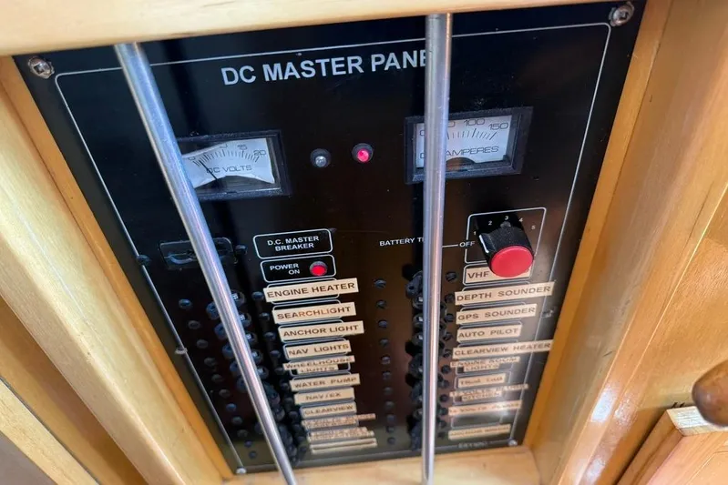  Yacht Photos Pics DC master panel on 2000 LEBLANC Leo 38 boat with various switches and gauges.