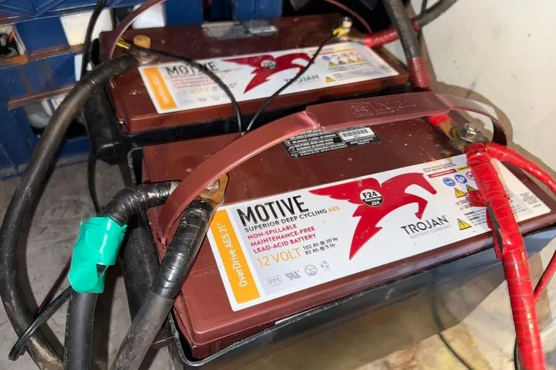  Yacht Photos Pics Two Trojan deep cycle batteries connected with cables in a LEBLANC Leo 38, 2000 model.
