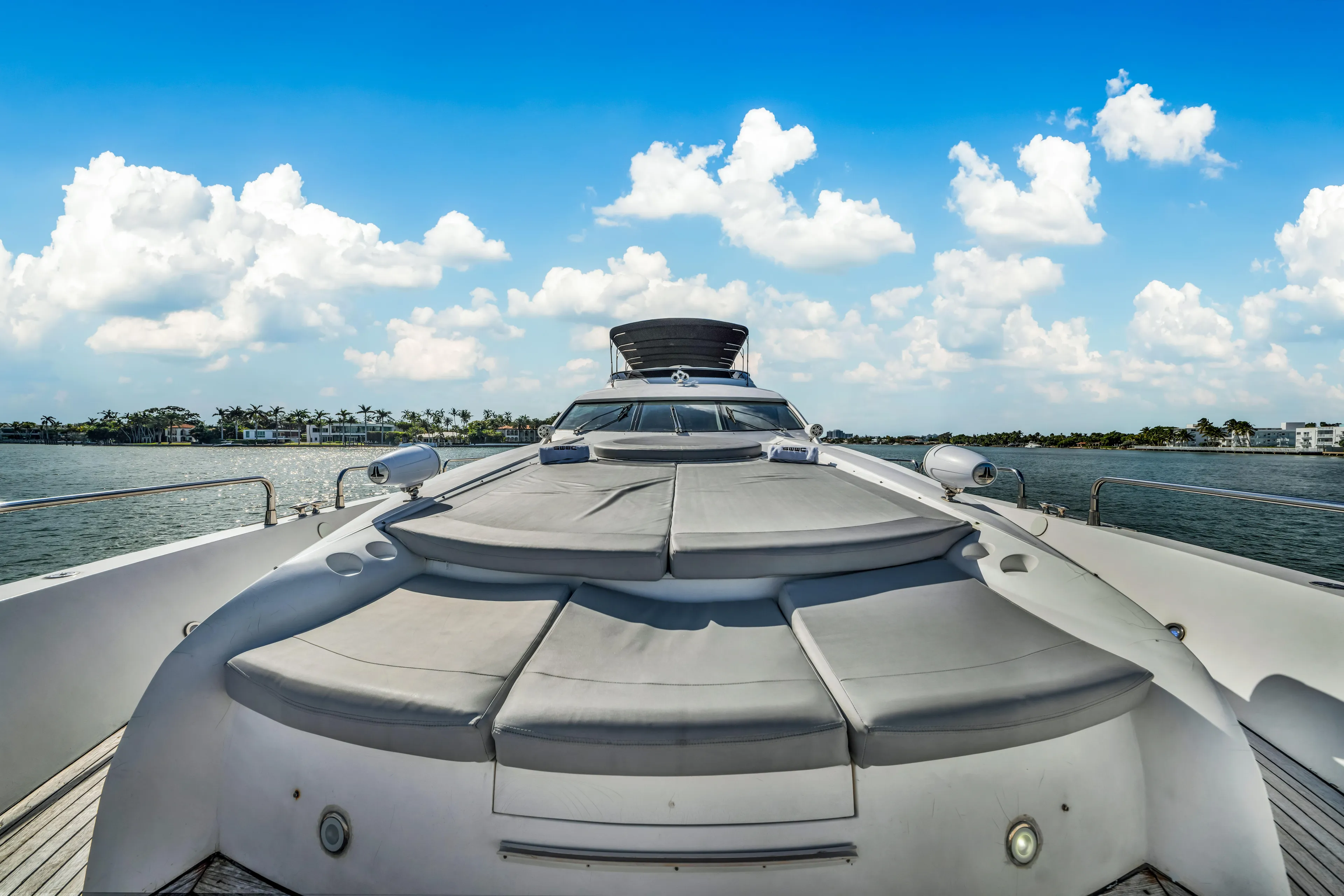 So What Who Cares Yacht Photos Pics Sunseeker 150 GT yacht deck, 2003 model, under a bright blue sky.