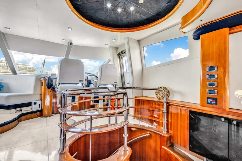 So What Who Cares Yacht Photos Pics Luxurious interior of 2003 Sunseeker 150 GT yacht with modern design and elegant wood finishes.