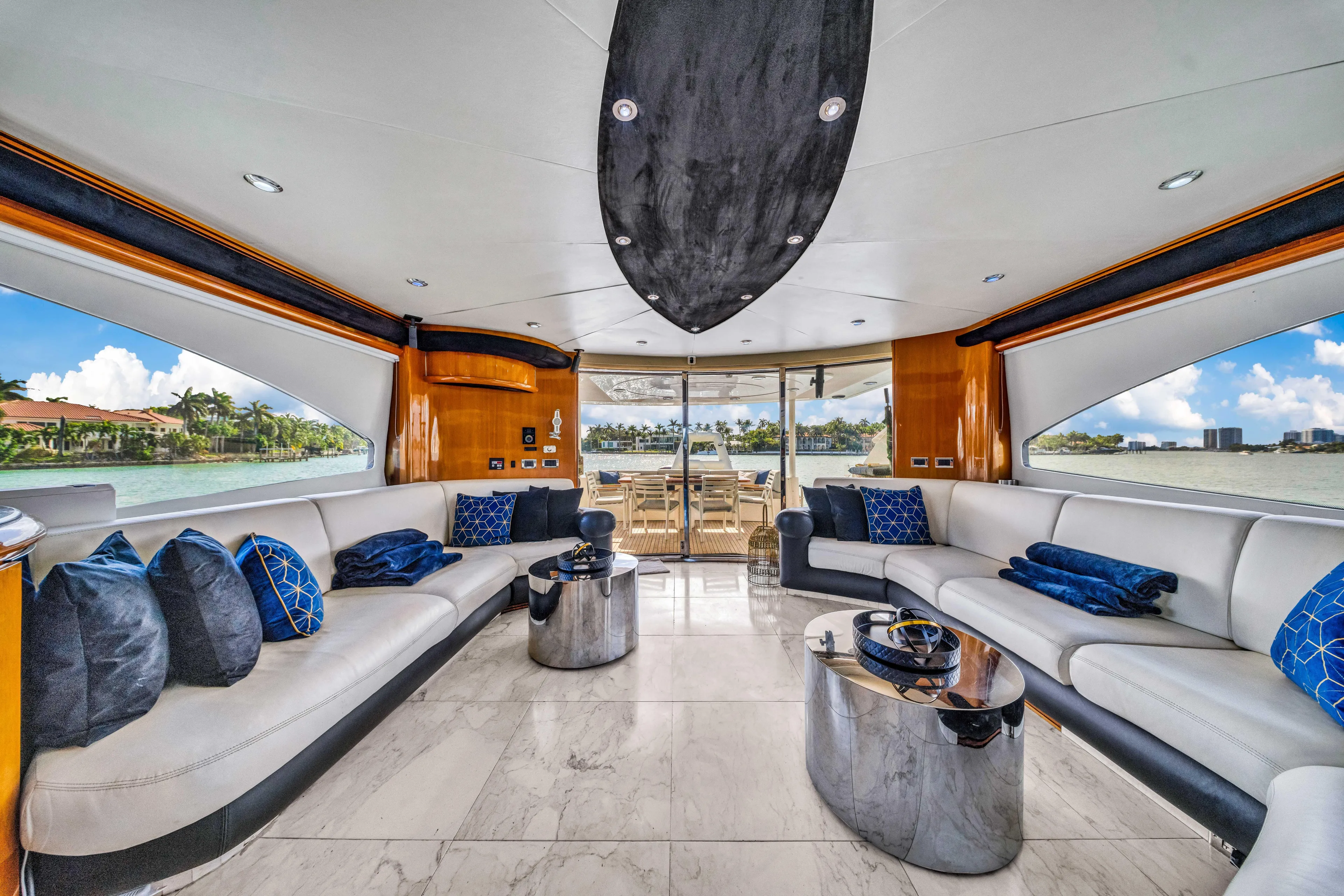 So What Who Cares Yacht Photos Pics Luxurious interior of 2003 Sunseeker 150 GT yacht with elegant seating and modern decor.