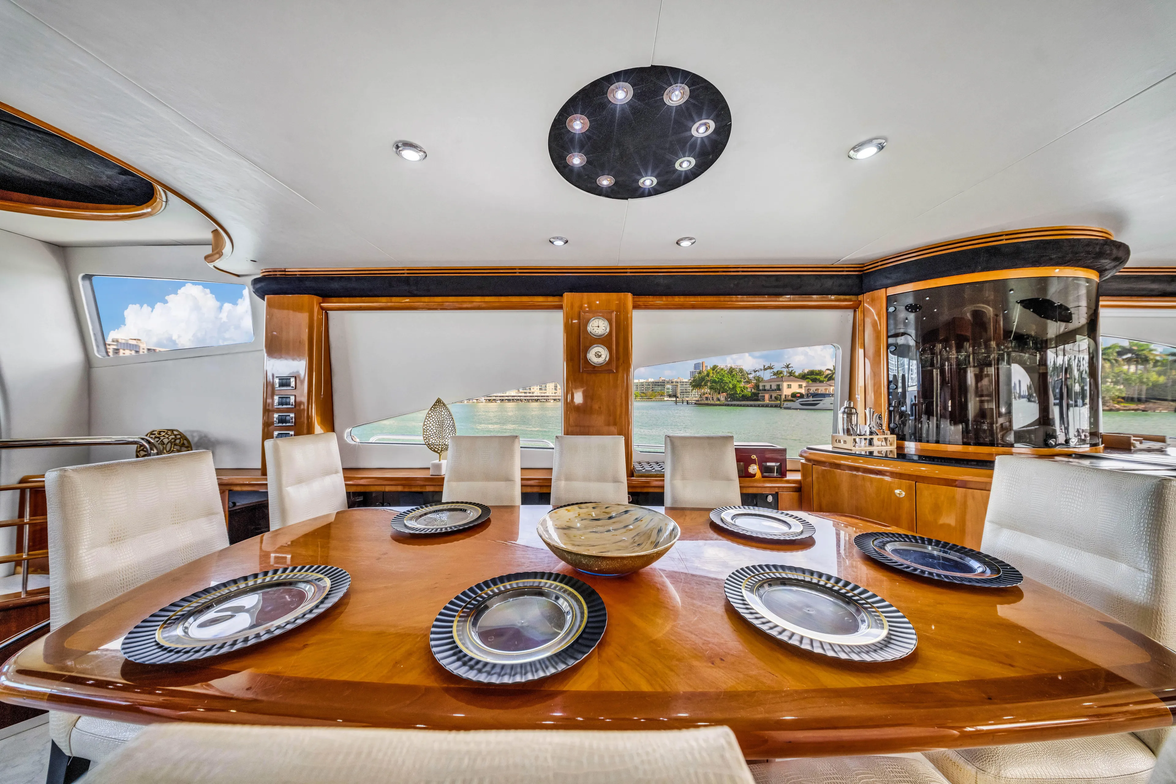 So What Who Cares Yacht Photos Pics Luxurious dining area on a 2003 Sunseeker 150 GT yacht with elegant table settings.