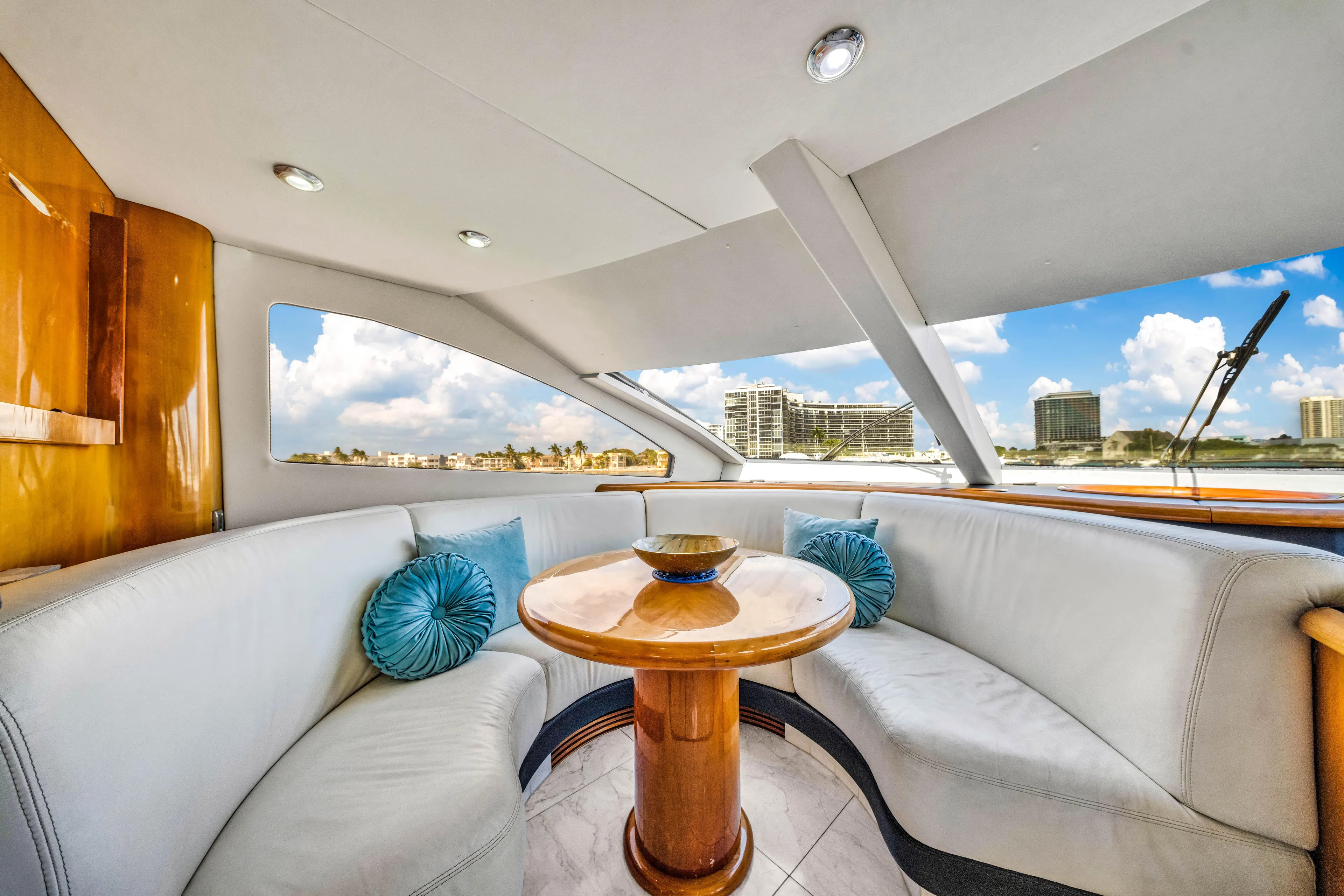 So What Who Cares Yacht Photos Pics Luxurious interior of 2003 Sunseeker 150 GT yacht with plush seating and scenic view.