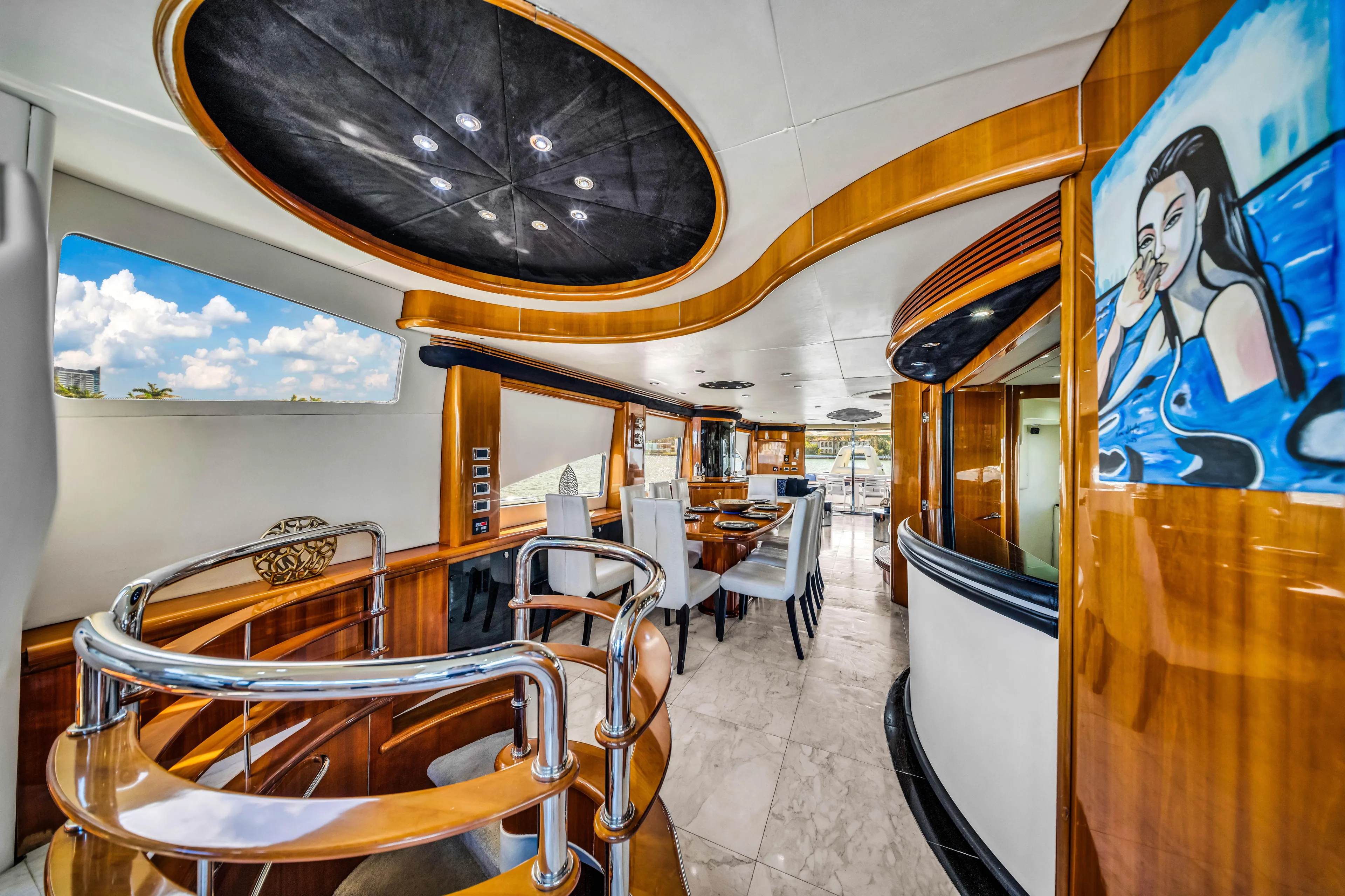 So What Who Cares Yacht Photos Pics Luxurious interior of 2003 Sunseeker 150 GT yacht with elegant wood finishes and modern design.