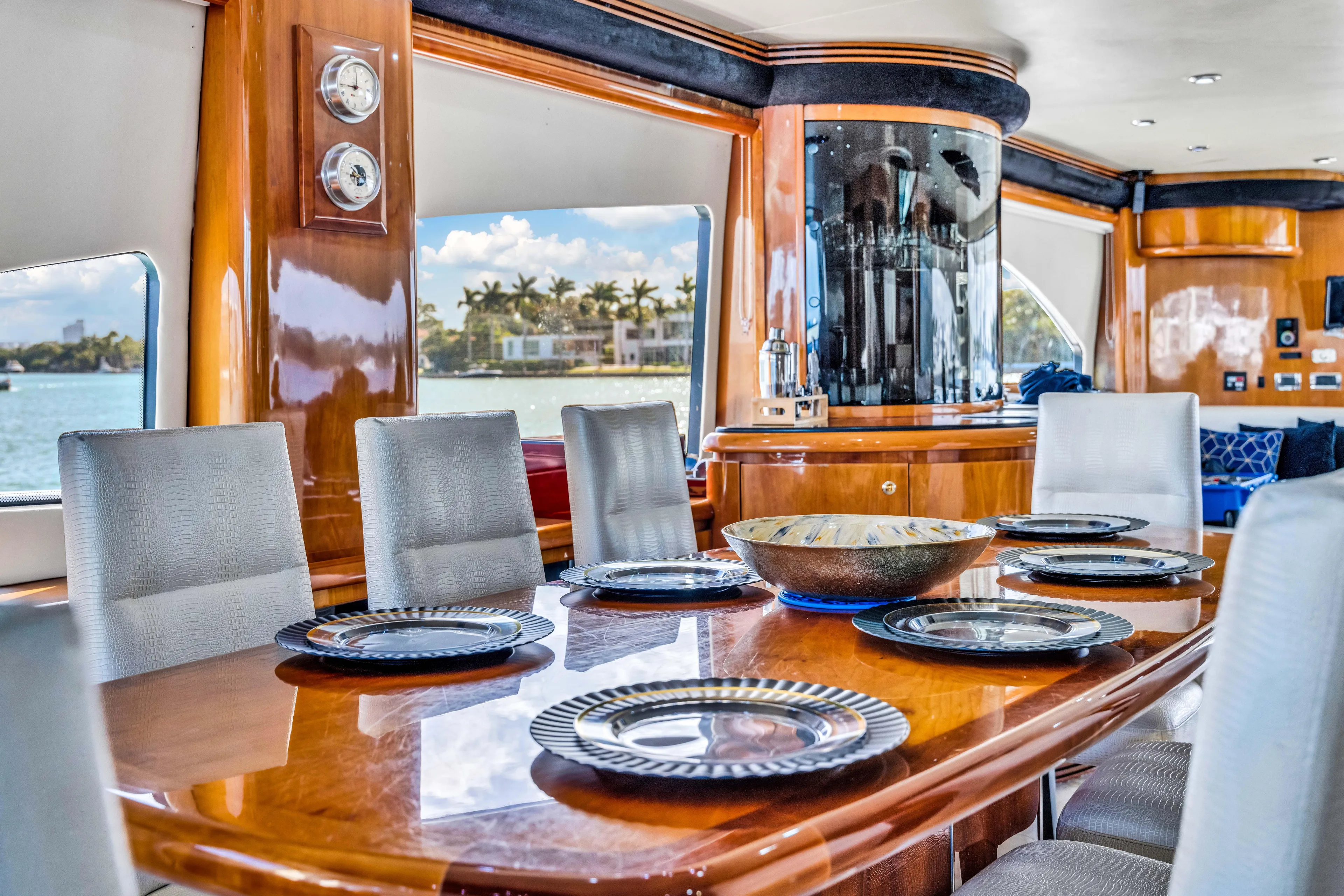 So What Who Cares Yacht Photos Pics Luxurious dining area on a 2003 Sunseeker 150 GT yacht with elegant wood finishes.