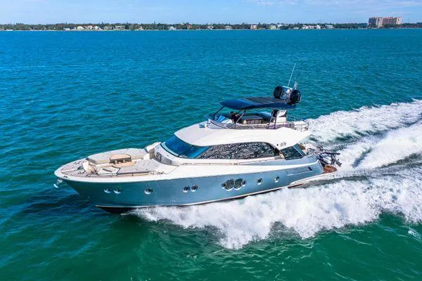 Yacht Photos Pics Luxurious 2018 Monte Carlo Yachts MCY 70 cruising on clear blue waters.