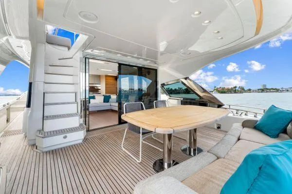  Yacht Photos Pics Luxurious 2018 Monte Carlo Yachts MCY 70 deck with seating and ocean view.