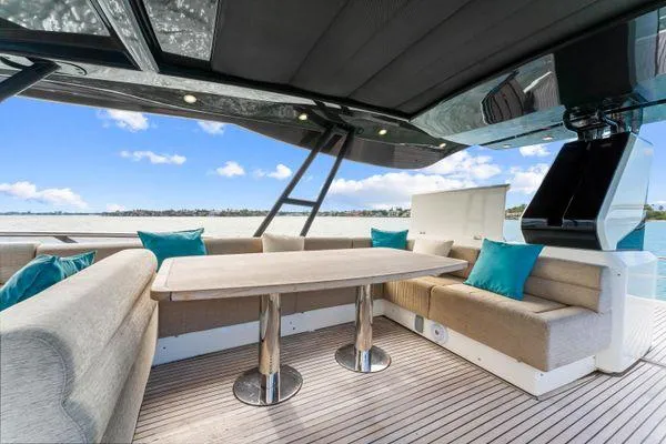  Yacht Photos Pics Luxurious Monte Carlo Yachts MCY 70 deck with elegant seating and ocean view, 2018 model.