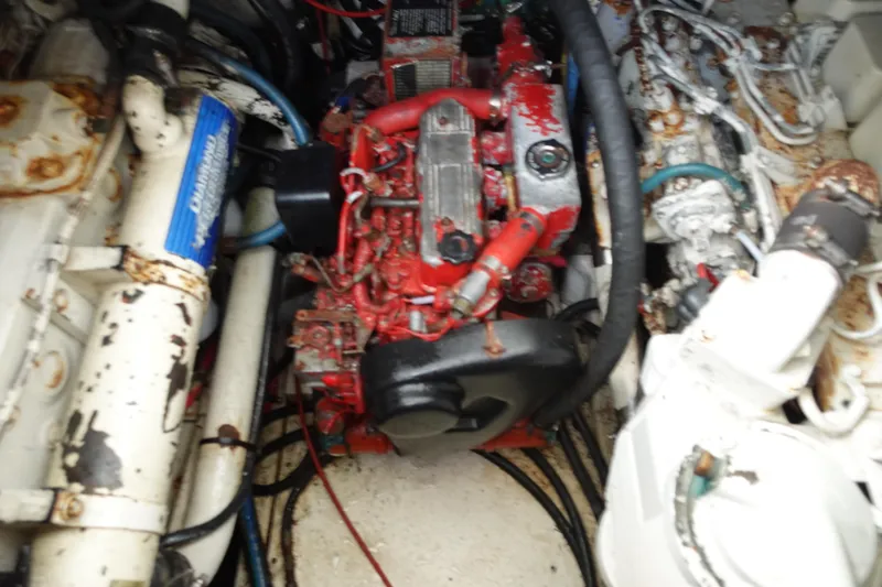  Yacht Photos Pics Engine compartment of a 1997 Pursuit 3400 Offshore boat, showing mechanical components.