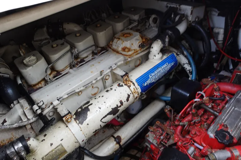  Yacht Photos Pics Engine compartment of a 1997 Pursuit 3400 Offshore boat, showing mechanical components.