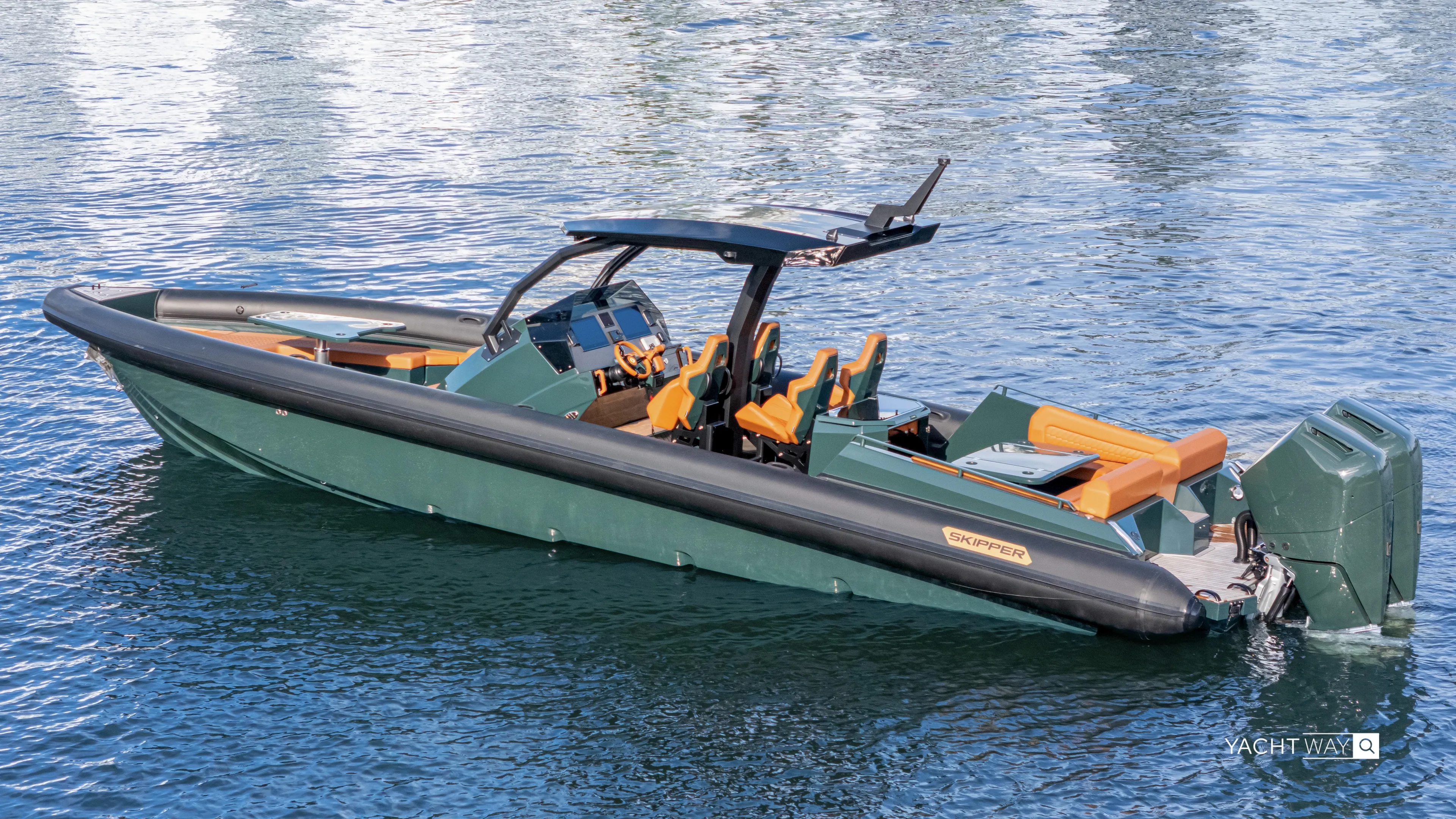 New 2025 Skipper 38 Twin 400 V10 Yacht Photos Pics 2025 Skipper-BSK 38 boat with sleek design, green hull, and orange seating on calm water.