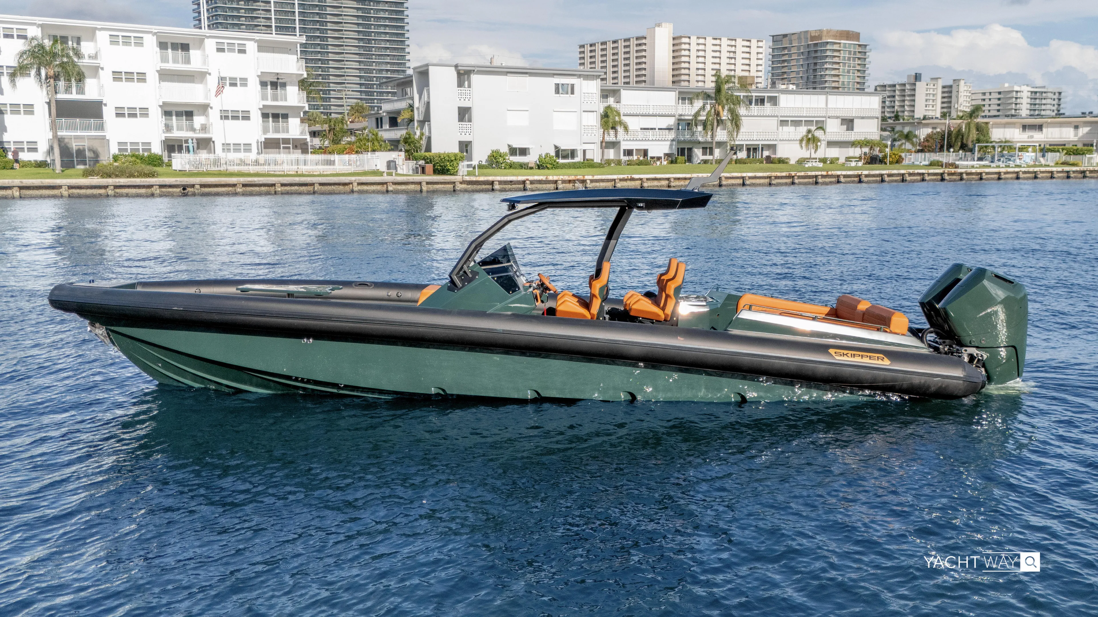 New 2025 Skipper 38 Twin 400 V10 Yacht Photos Pics 2025 Skipper-BSK 38 boat on water, modern design, cityscape background.