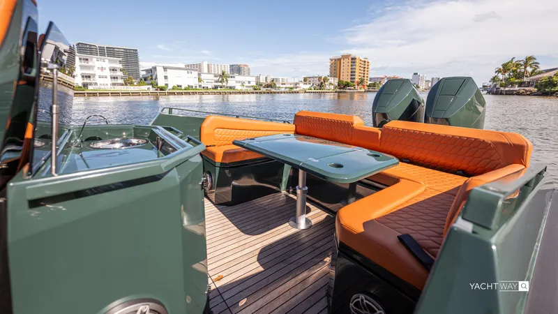New 2025 Skipper 38 Twin 400 V10 Yacht Photos Pics Luxurious 2025 Skipper-BSK 38 yacht interior with orange seating and waterfront view.