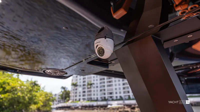 New 2025 Skipper 38 Twin 400 V10 Yacht Photos Pics 2025 Skipper-BSK 38 yacht with Garmin camera, docked near waterfront buildings.