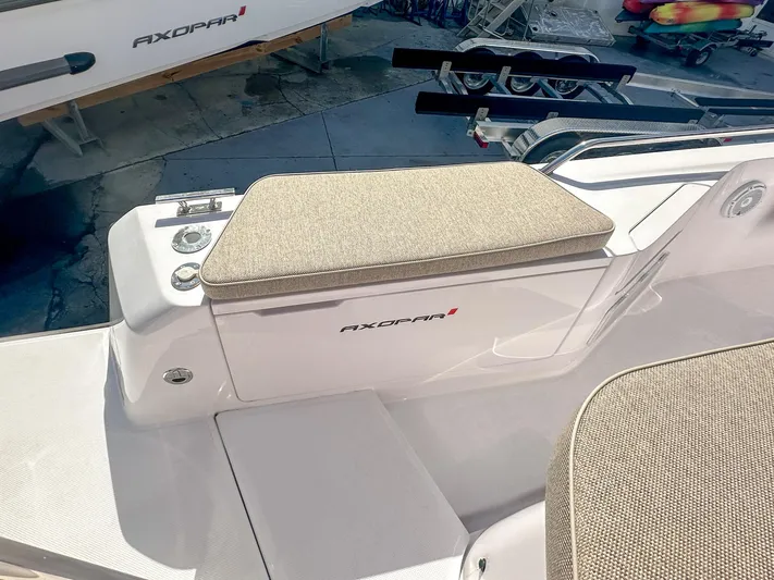  Yacht Photos Pics 2024 Axopar 37XC CROSS CABIN boat interior with cushioned seating and sleek design.
