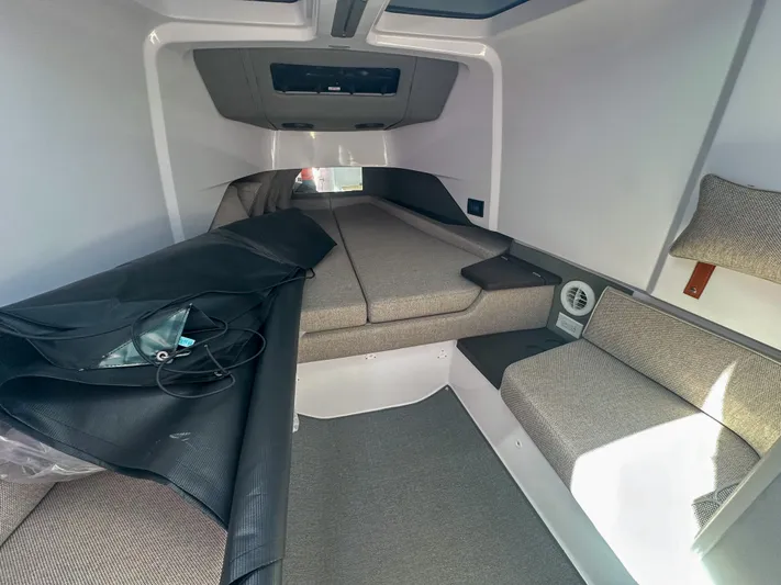  Yacht Photos Pics 2024 Axopar 37XC CROSS CABIN interior with seating and storage.