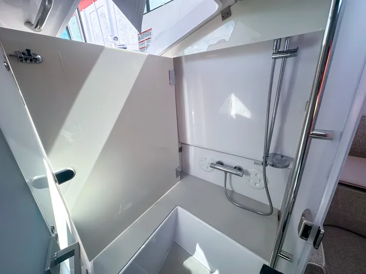  Yacht Photos Pics 2024 Axopar 37XC CROSS CABIN interior shower area with modern fixtures and sleek design.