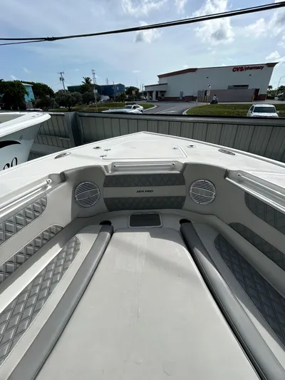  Yacht Photos Pics 2024 Sea Pro 320 DLX Center Console boat interior with cushioned seating and speakers.