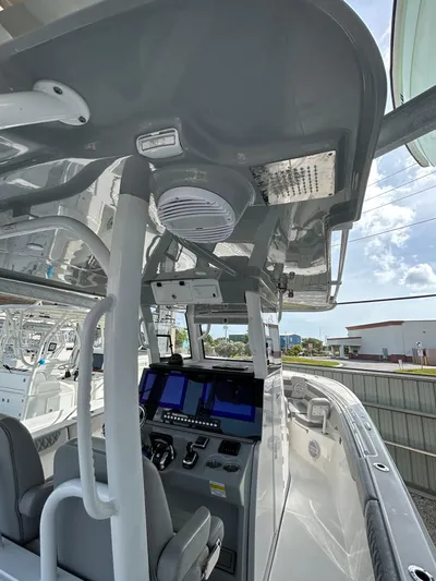  Yacht Photos Pics 2024 Sea Pro 320 DLX Center Console boat interior with advanced navigation controls and seating.