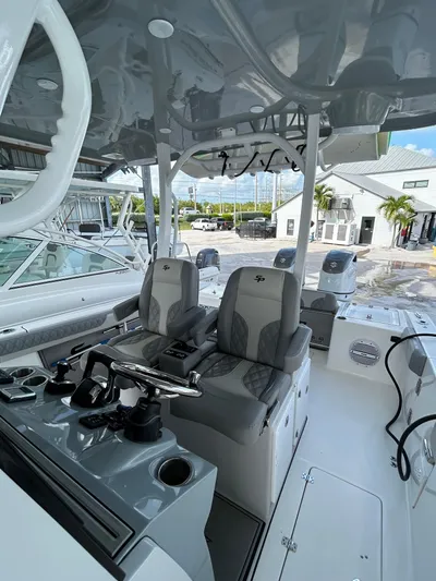  Yacht Photos Pics 2024 Sea Pro 320 DLX Center Console boat interior with modern seating and controls.