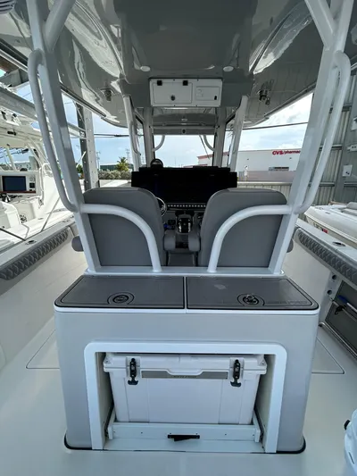  Yacht Photos Pics 2024 Sea Pro 320 DLX Center Console interior with helm and seating area.
