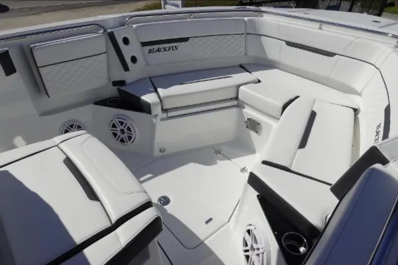  Yacht Photos Pics 2021 Blackfin 272 CC boat interior with white seating and speakers.