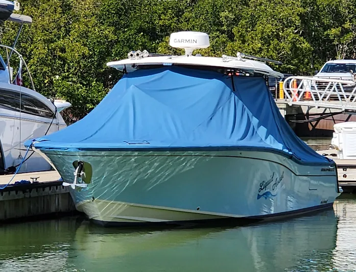 Liquid Asset Yacht Photos Pics 2022 Grady-White 326 CANYON boat docked with blue cover.