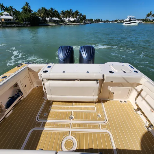 Liquid Asset Yacht Photos Pics 2022 Grady-White 326 CANYON boat with twin engines on a sunny day.