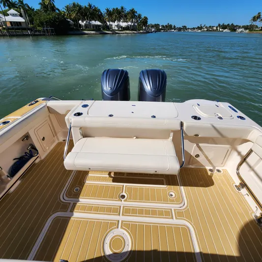 Liquid Asset Yacht Photos Pics 2022 Grady-White 326 CANYON boat with twin engines on a sunny day.