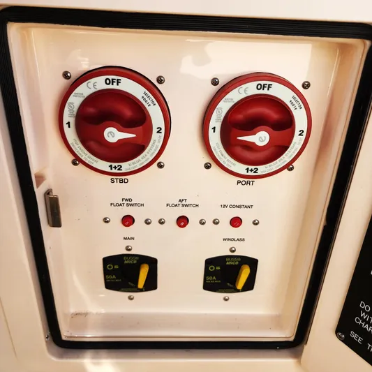 Liquid Asset Yacht Photos Pics Control panel of a 2022 Grady-White 326 CANYON boat with switches and dials.
