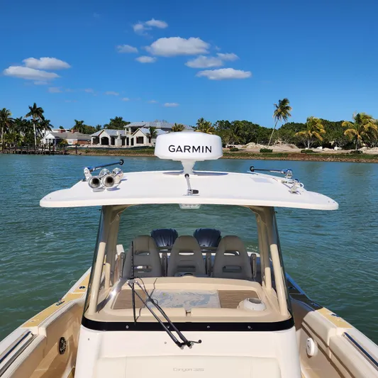 Liquid Asset Yacht Photos Pics 2022 Grady-White 326 CANYON boat on water with Garmin equipment.