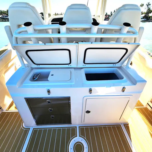 Liquid Asset Yacht Photos Pics 2022 Grady-White 326 CANYON boat interior with storage compartments and seating.