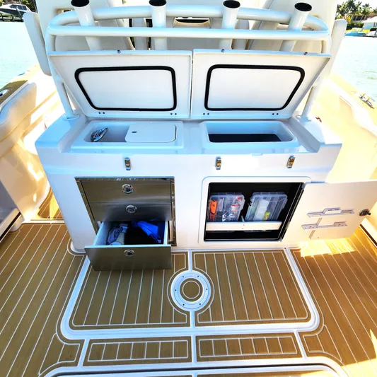 Liquid Asset Yacht Photos Pics 2022 Grady-White 326 CANYON boat deck with storage compartments open.